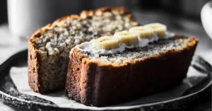 Freshly baked 4 ingredient banana bread with a golden crust and soft, moist slices