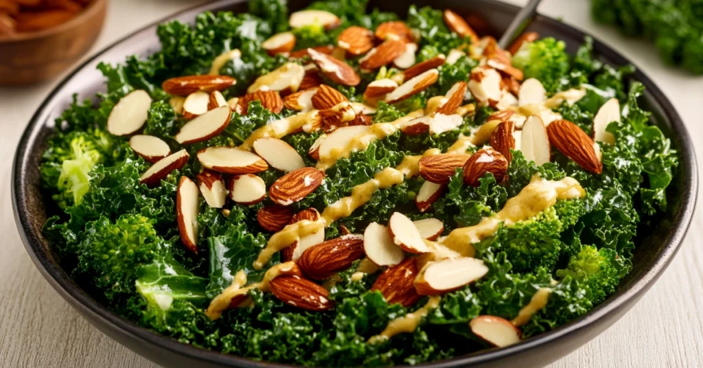 A close-up of a Chick-fil-A kale salad with fresh kale, broccolini, and sliced almonds on a rustic wooden table.