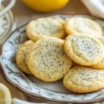 Lemon poppy seed cookies arranged on a serving plate.