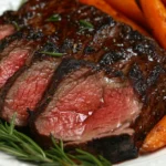 Sliced ribeye roast on a serving platter